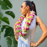 Inspired by lush tropical landscapes, the Tropical Harmony Lei is a double strand orchid lei featuring 100+ fresh orchids in a blend of purple, white, and green hues. This lei is ideal for weddings, graduations, Hawaiian luaus, and elegant events, flown fresh from Thailand for lasting beauty