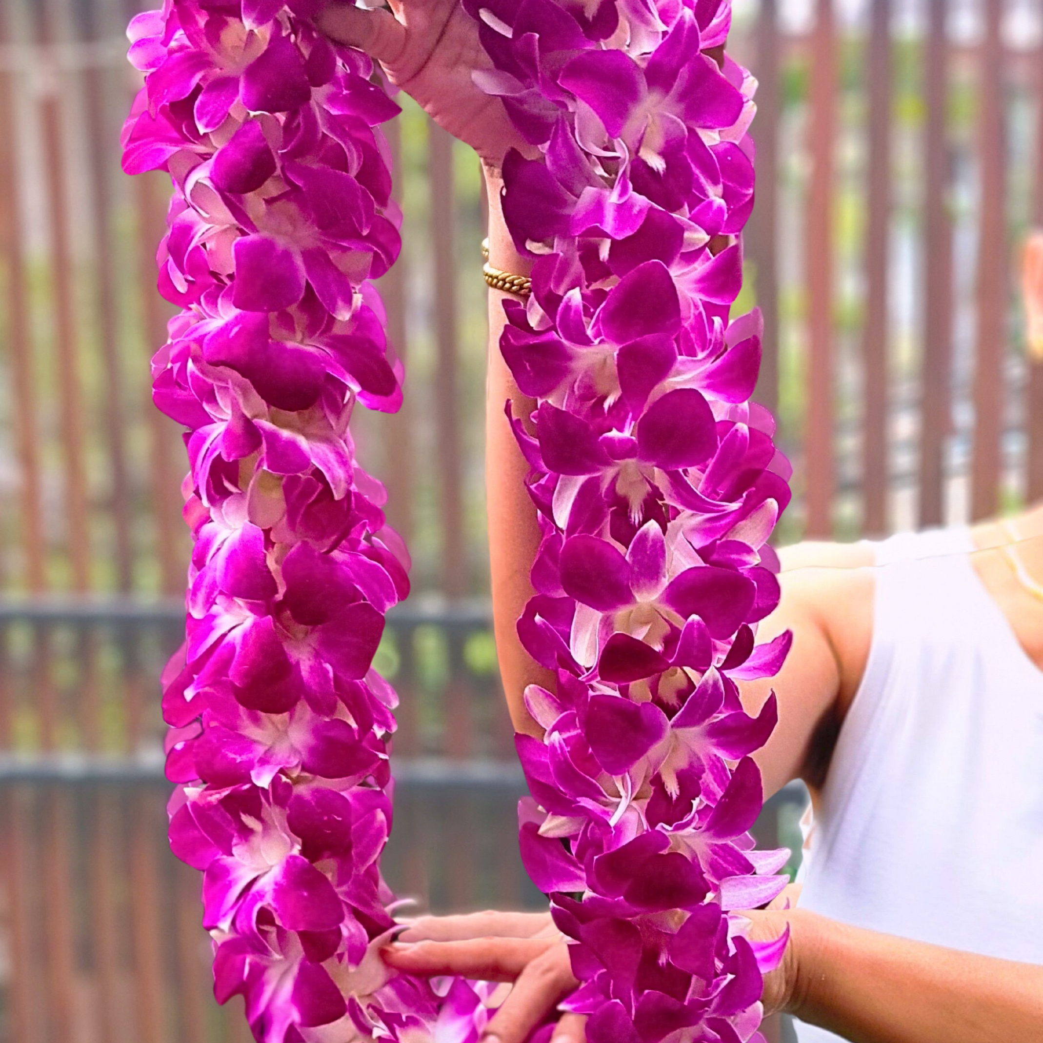 Fresh Double Purple Orchid Lei featuring 100 Thai Dendrobium orchids. This durable and vibrant lei is great for weddings, beach events, and upscale parties. Freshly flown in weekly for the best quality. 