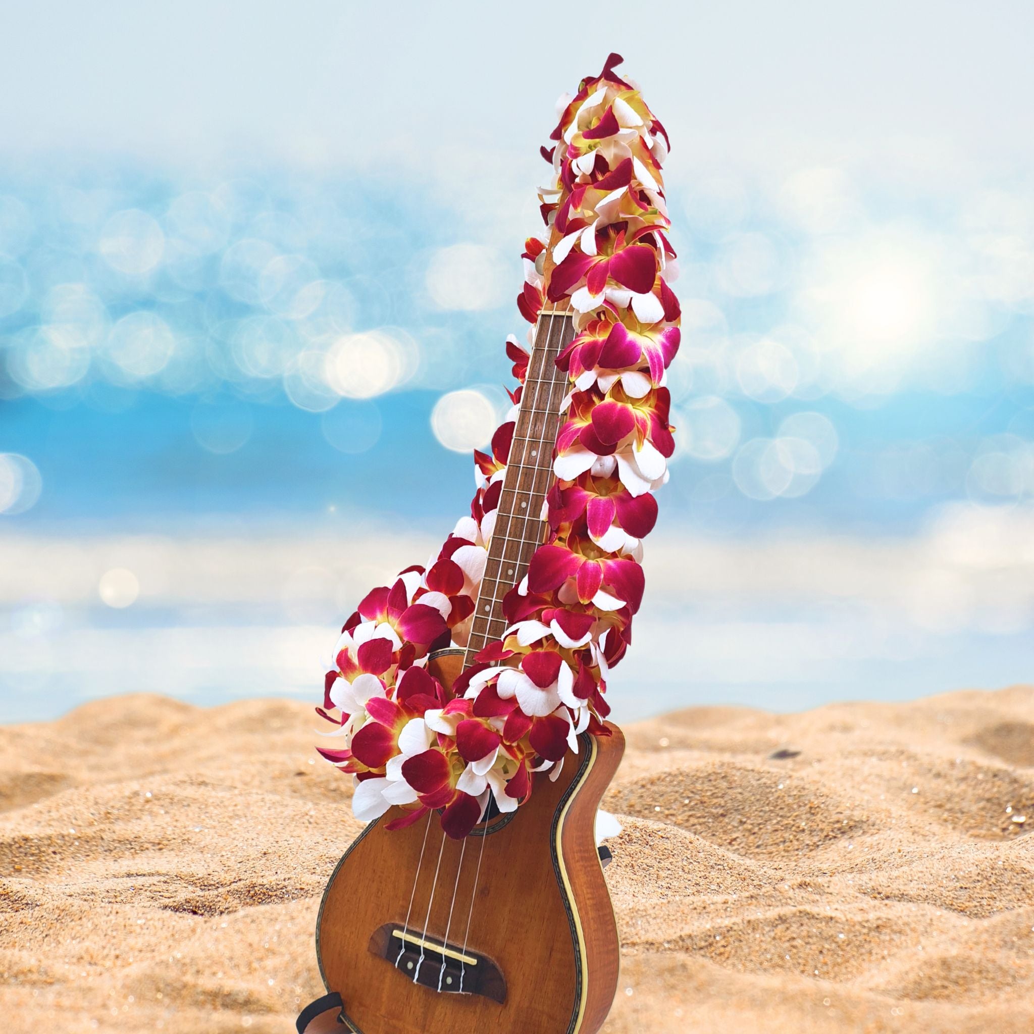 Tequila Sunrise Double Orchid Lei – Handmade Tropical Necklace. A stunning red, yellow, and white floral lei perfect for weddings, Hawaiian luaus, graduations & tropical parties. Fresh orchids flown from Thailand. Elegant & durable.