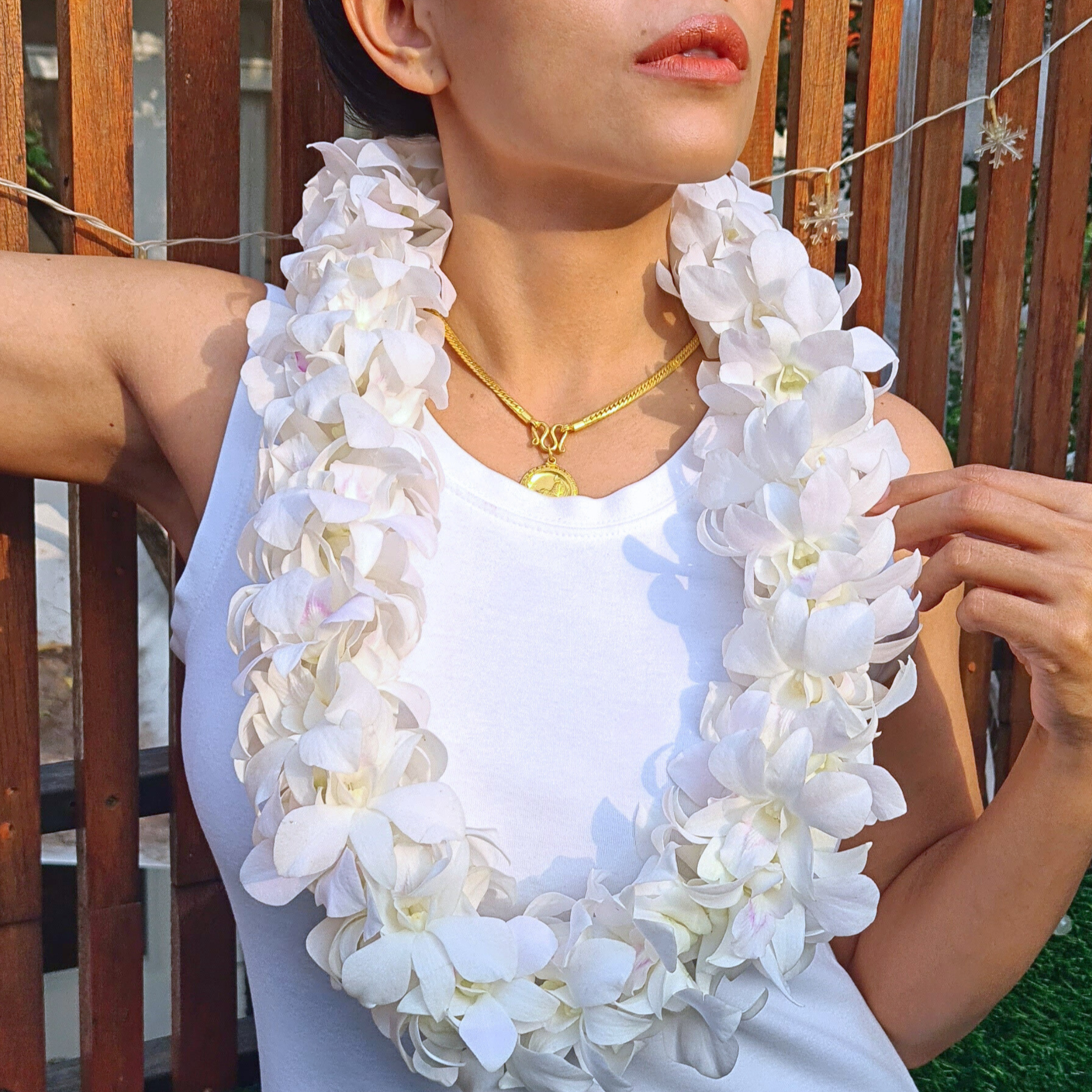 Double thick White Orchid Lei crafted from 100+ fresh Thai Dendrobium orchids, measuring 39 inches. Perfect for weddings, tropical parties, graduations, and Hawaii-style events, this lei is both beautiful and long-lasting. A stunning floral accessory