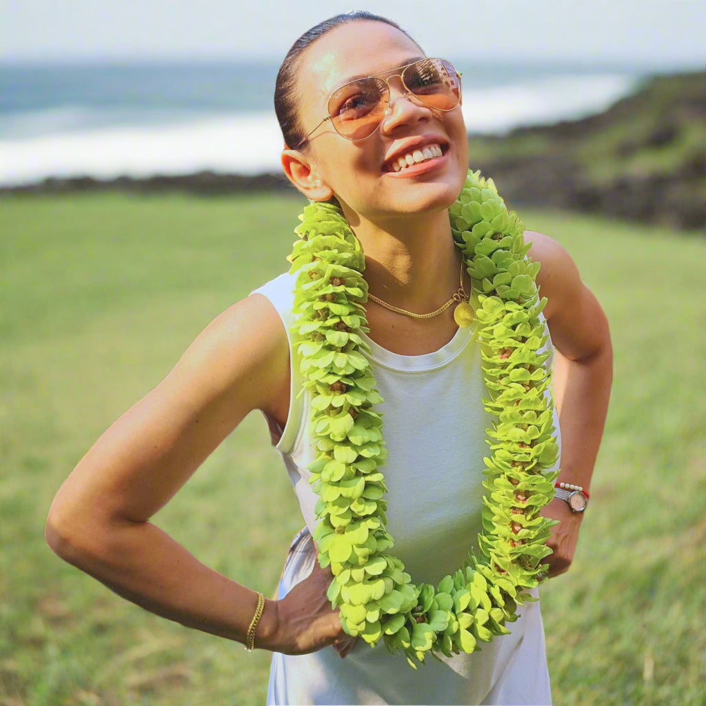 Green Double Orchid Lei for Hawaiian-themed events, beach weddings, graduations & tropical luaus. Handmade floral necklace crafted with fresh orchids. Stunning Jade Serenity Lei flown fresh from Thailand. Luxurious, elegant, & bold floral accessory.