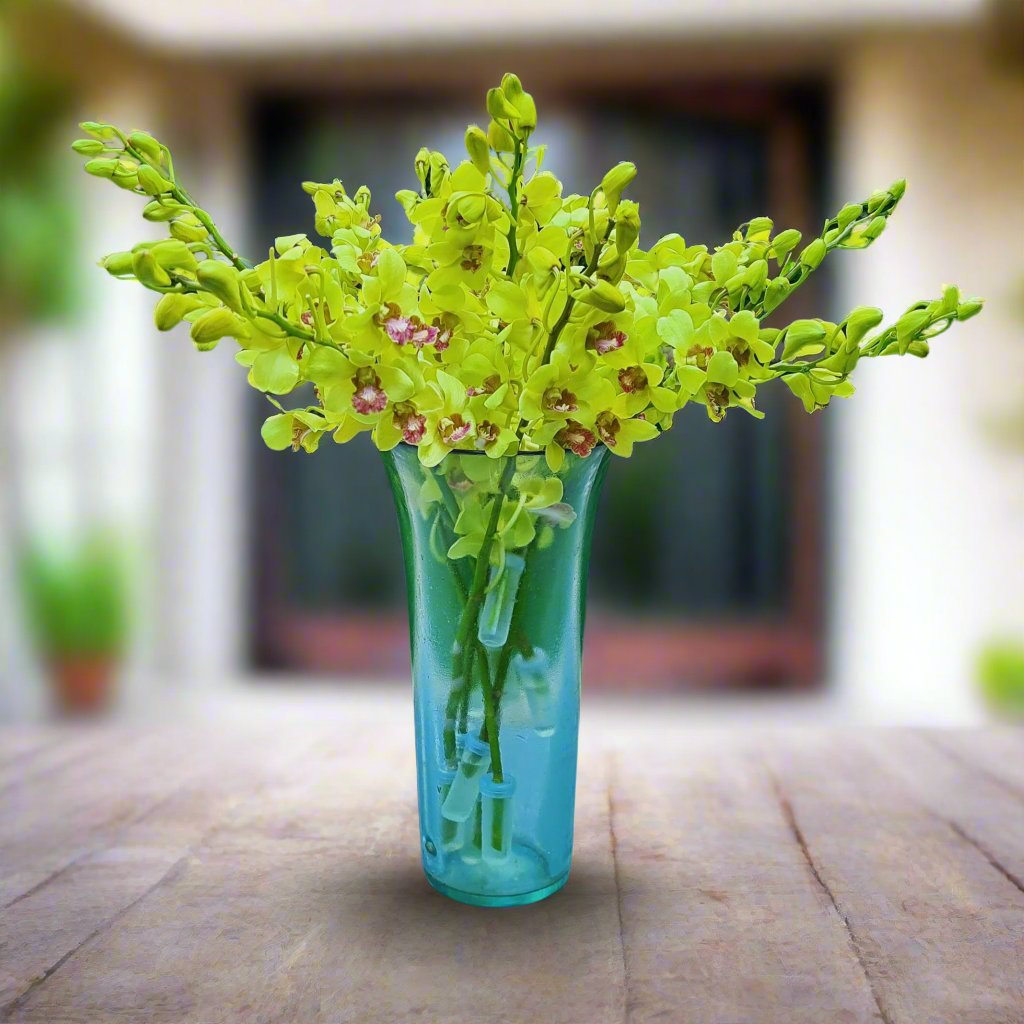 Farm-fresh Thai Jade Green orchids, 10 Dendrobium stems. Ideal for creating wedding floral arrangements, DIY decor, bouquets, and centerpieces. The rare jade color provides an elegant touch to any special event.