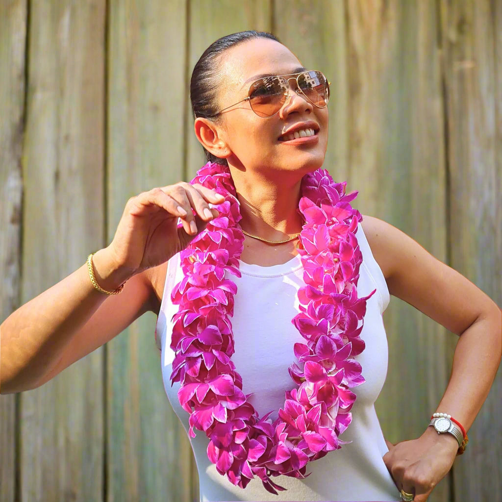 Introducing the Pink Splash Lei, a double strand lei featuring white orchids with a soft pink splash on the petals. Perfect for weddings, graduations, and tropical events, this stunning floral accessory adds a unique, artistic flair to your celebration. The combination of white and pink blooms creates an eye-catching and elegant design that will leave a lasting impression at any event.