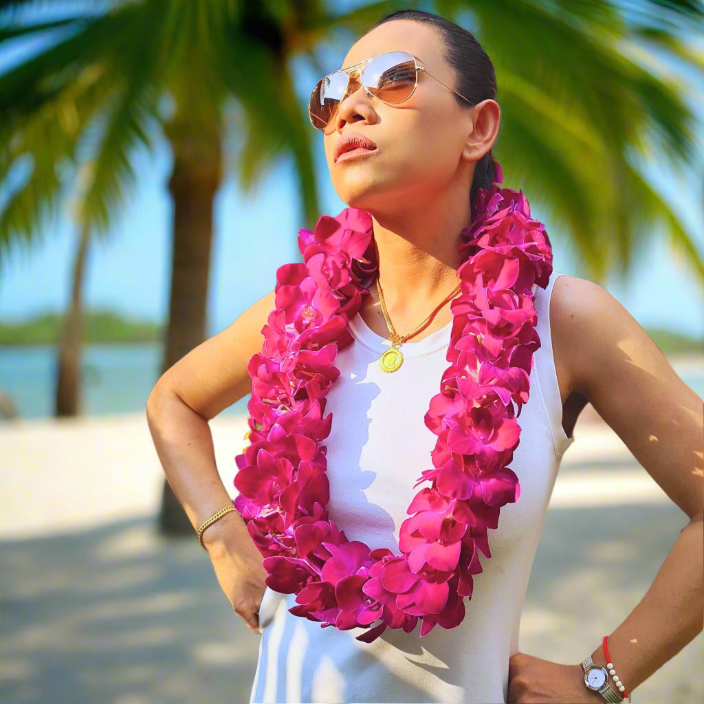 The Red Bull Double Orchid Lei is a striking floral garland featuring deep red and purple Thai orchids, carefully handwoven into a full double-strand design. This bold lei symbolizes strength and passion, making it an ideal choice for graduations, weddings, and Hawaiian luaus. Freshly flown from Thailand, it offers long-lasting beauty and durability, ensuring an eye-catching statement piece for any tropical celebration or special occasion.