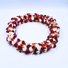 Handmade Orchid Lei – Tequila Sunrise Double-Strand Lei. A bold floral necklace made from fresh orchids. Ideal for beach weddings, Hawaiian luaus, graduations & milestone celebrations. Flown fresh from Thailand for long-lasting quality