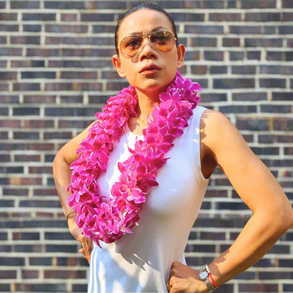Freshly handcrafted, the Pink Splash Lei features beautiful white orchids with a pink splash on the petals, creating a unique and eye-catching design. Perfect for weddings, graduations, and tropical events, this double strand lei is the perfect accessory to add a burst of color and elegance to any outfit. The soft pink and white blooms create a romantic, chic look that will turn heads and leave a lasting impression.