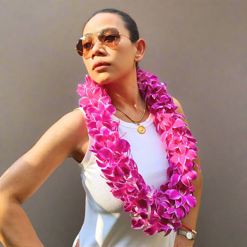 Add a burst of elegance to your celebration with the Pink Splash Lei. Made from fresh white orchids adorned with a soft pink splash, this double strand lei is perfect for weddings, graduations, and tropical events. Its one-of-a-kind design offers a touch of whimsy and sophistication, creating a memorable look for your special occasion. Handcrafted from premium orchids, it’s a must-have accessory for any stylish event.