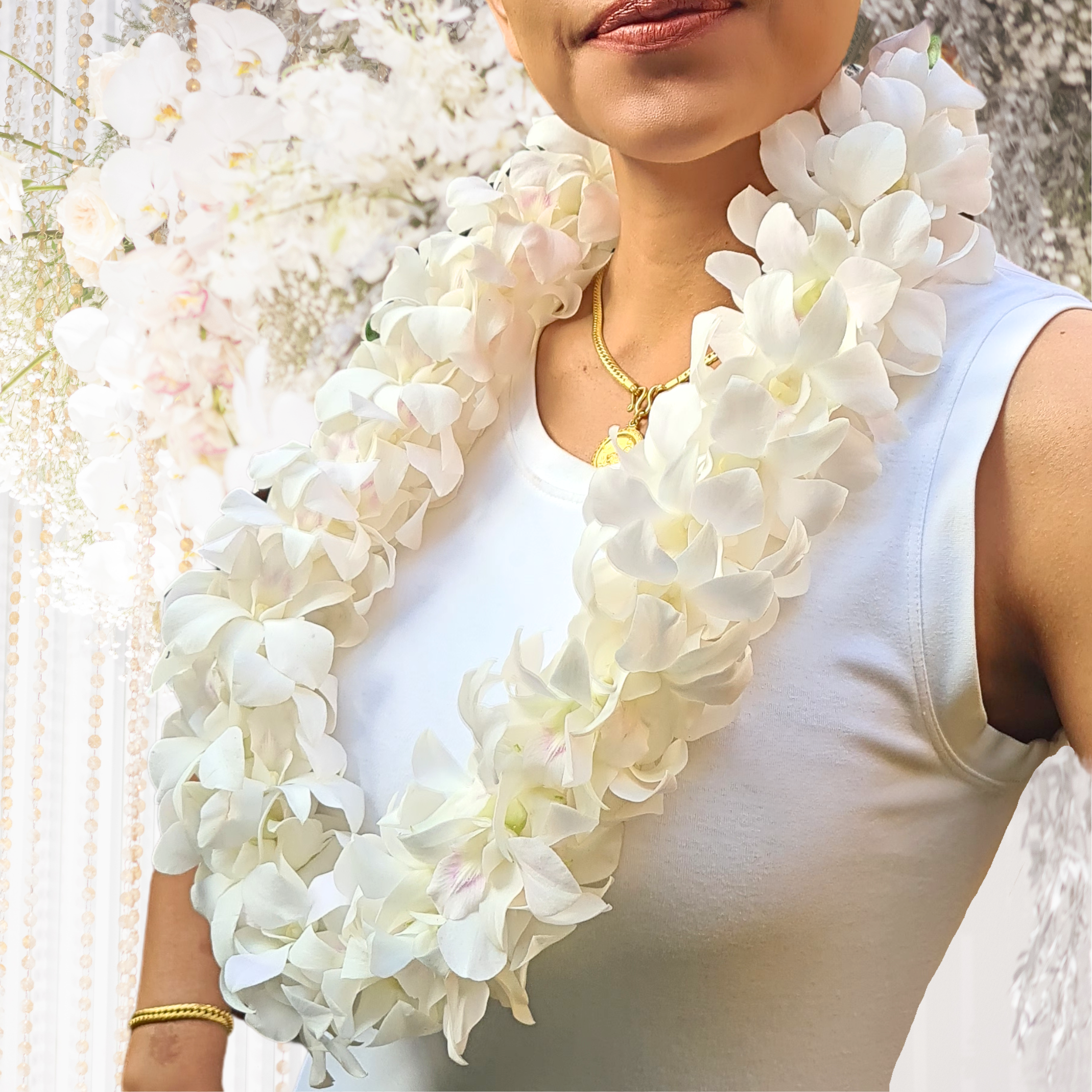 Exquisite Double Thick White Orchid Lei with 100+ fresh Dendrobium blooms, 39 inches in length. Perfect for weddings, hotel events, and Hawaii-style celebrations, this floral accessory combines elegance and durability for any occasion