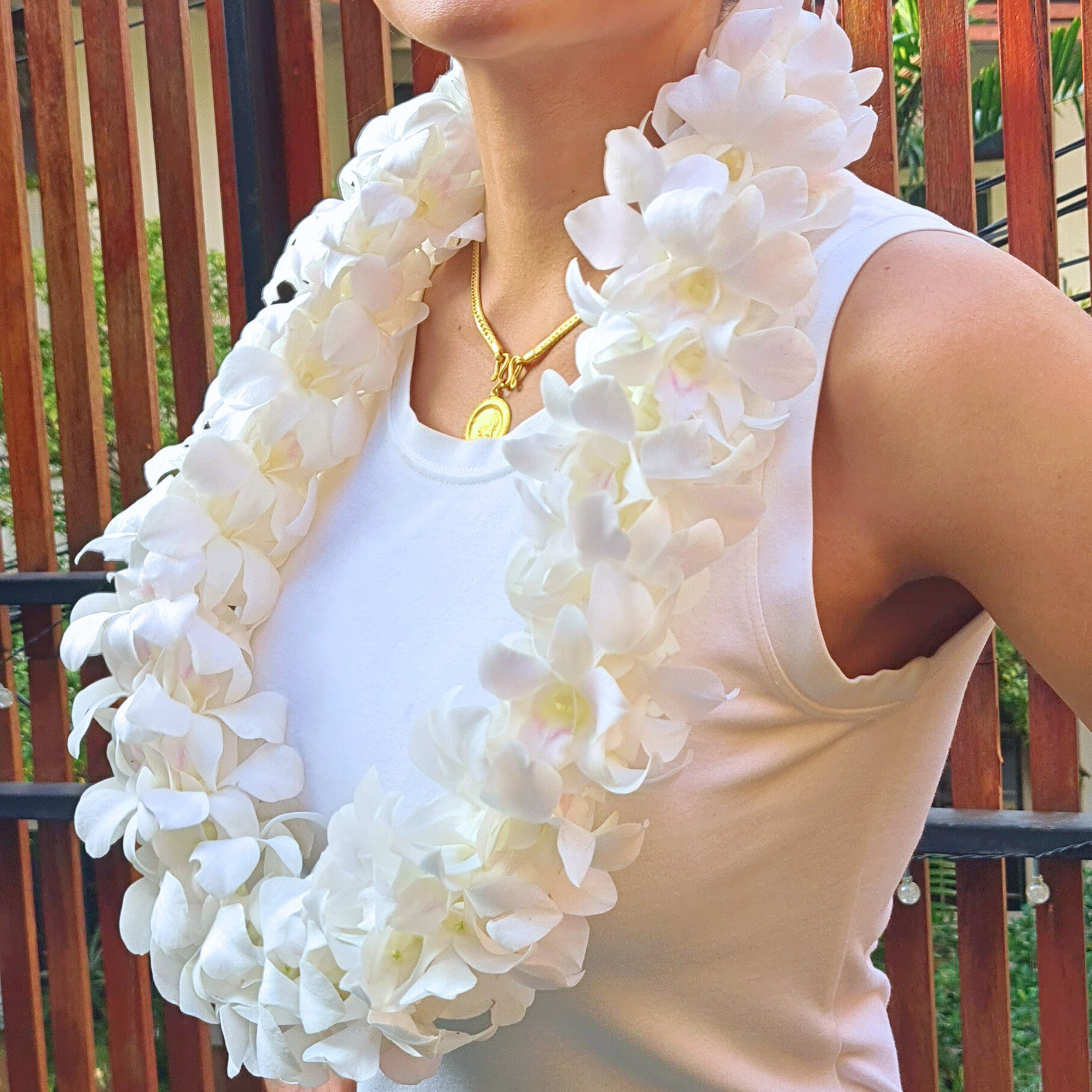 Stunning Double Thick White Lei featuring 100+ fresh Dendrobium orchids, measuring 39 inches. Ideal for weddings, pool parties, and tropical events, this floral accessory combines beauty and durability for unforgettable celebrations