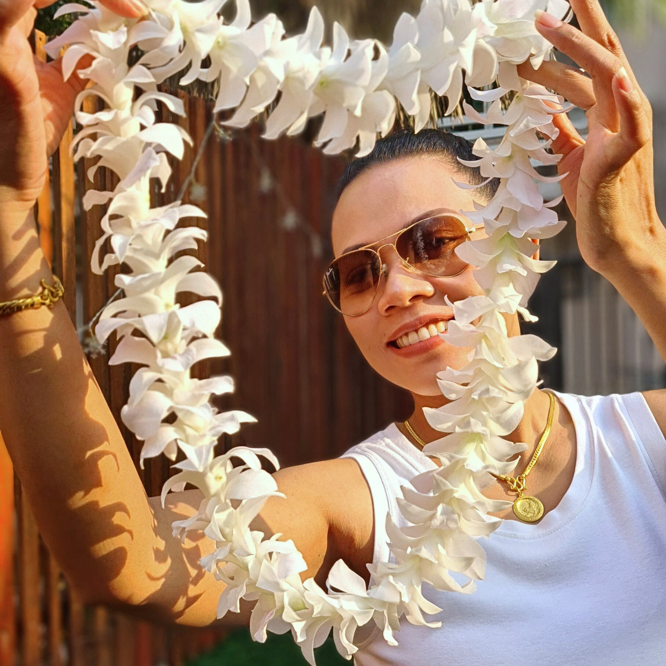 Stunning white orchid lei crafted with fresh, high-quality Dendrobium orchids. Ideal for weddings, beach parties, graduations, luaus, and tropical celebrations. Hand-stitched blooms from Thailand, creating an elegant accessory for any occasion